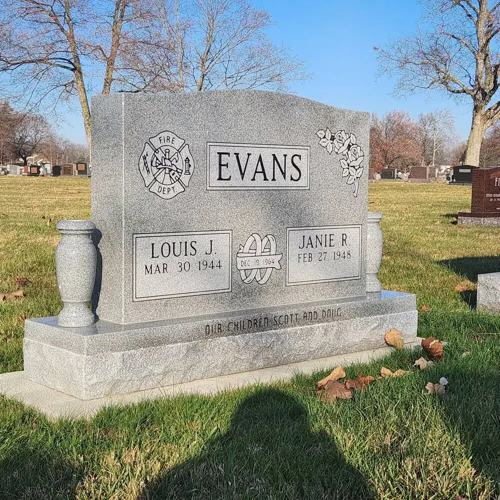 A granite upright monument standing in an Ohio cemetery