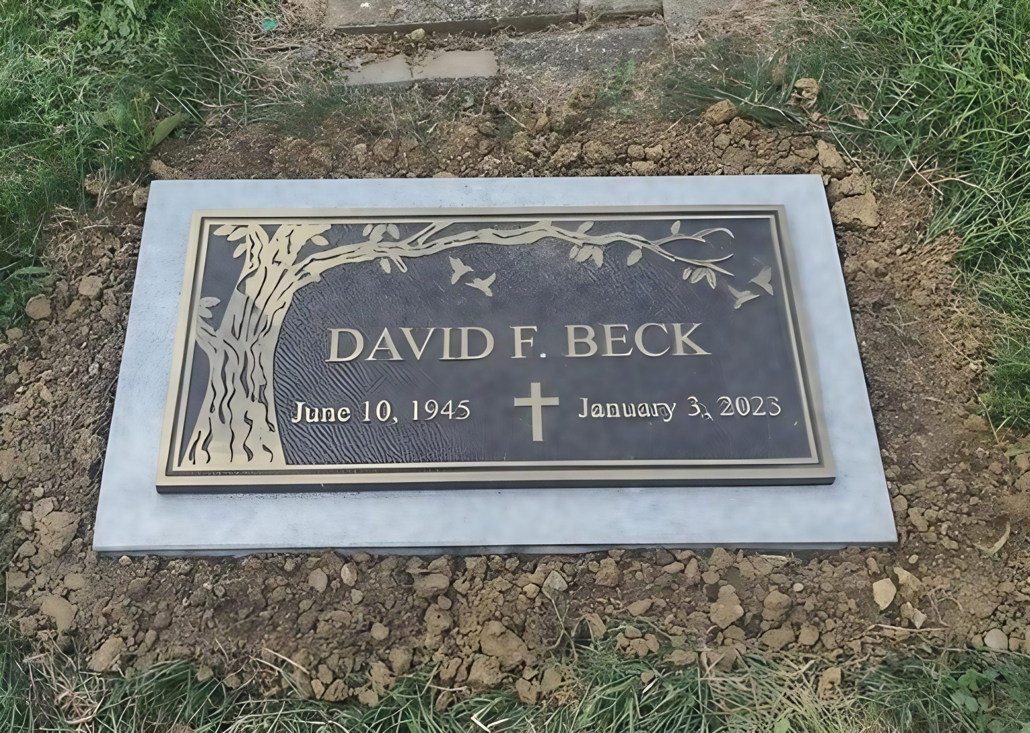 Bronze grave marker with a custom engraved design by Stoltz Memorials in {Indiana(city_name}