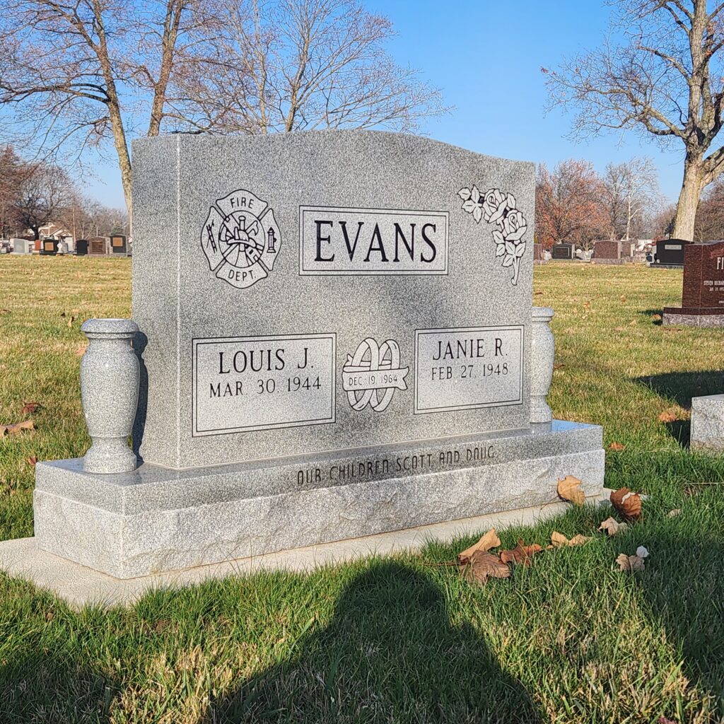 Companion upright monument crafted in polished granite with dual name engravings and elegant detailing, honoring two loved ones together.