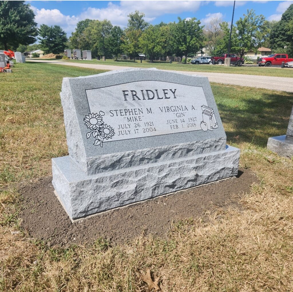 Companion slant granite marker with dual name engravings, featuring a gently angled face for clear visibility and a timeless shared tribute.