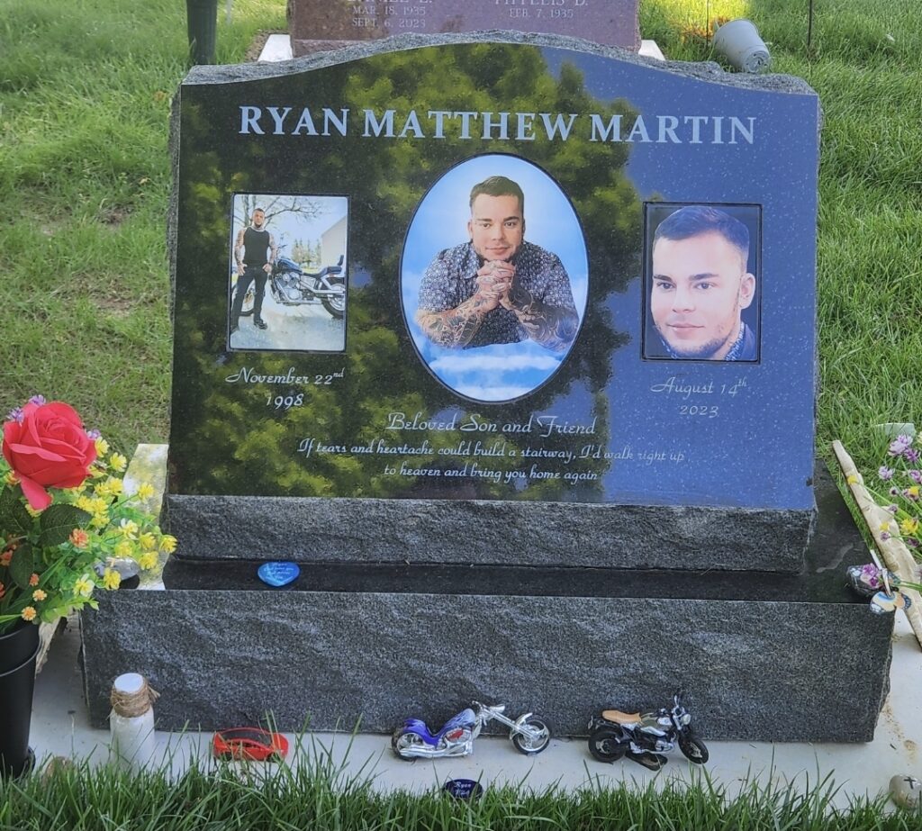 Single slant granite marker with custom engraving, featuring a gently angled face for easy reading and a timeless memorial design.