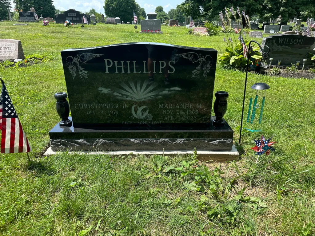 Companion upright monument in premium granite with two engraved name panels, offering a timeless tribute to loved ones resting together.