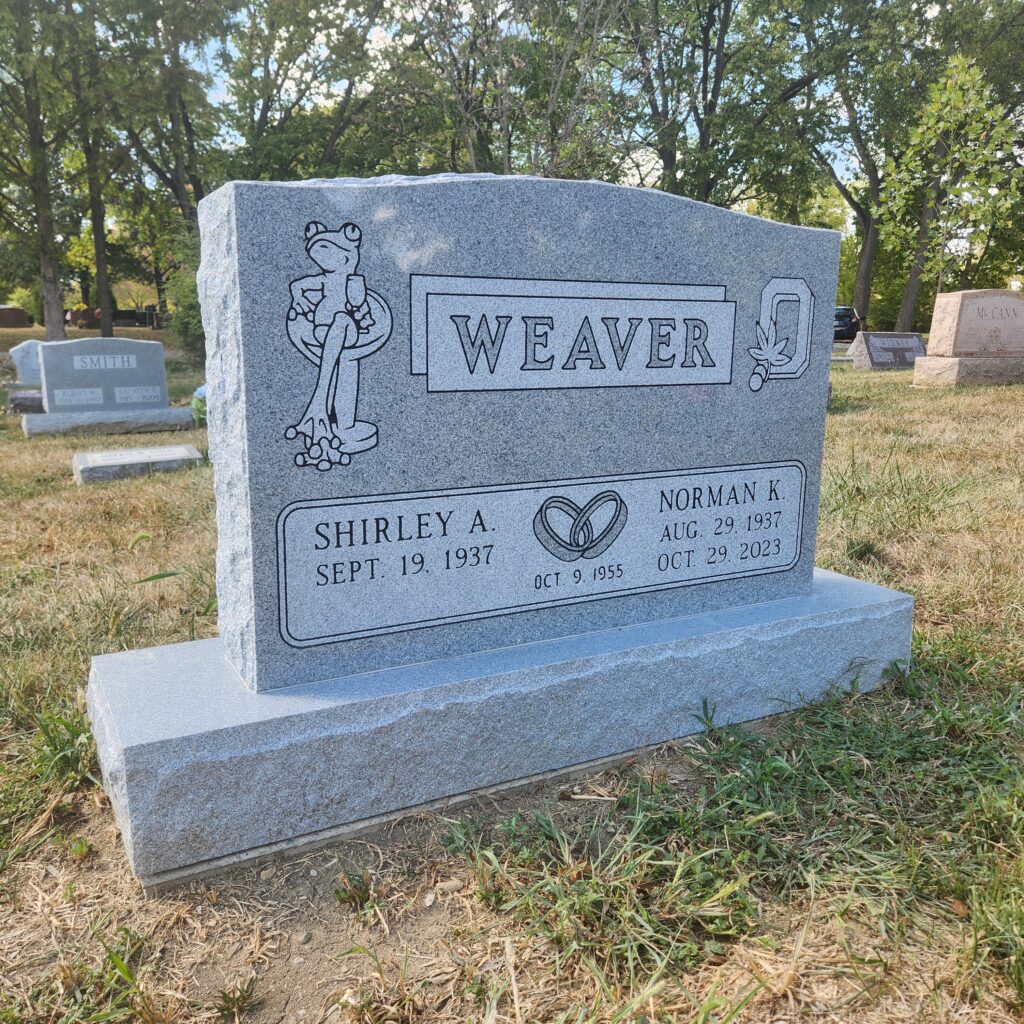 Companion upright granite monument with dual name engravings and classic detailing, offering a timeless tribute for two loved ones.