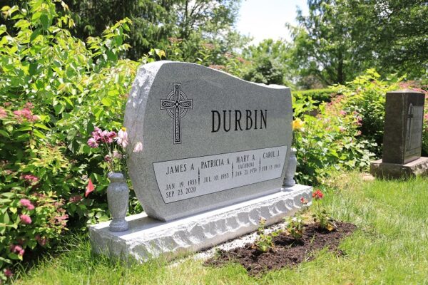 A diagram or example of a granite memorial bench used as a functional cemetery monument alternative.