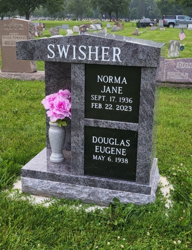 A granite cremation bench with a built-in niche for urn storage, designed for a Cincinnati cemetery.