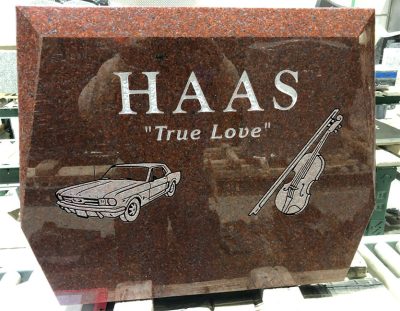 A custom-designed granite companion headstone featuring a heart shape and 'True Love' engraving, representing our ability to create unique, personalized tributes.