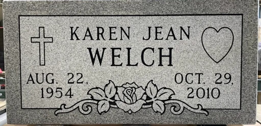 A polished grey granite flat marker headstone engraved with name and dates, displaying the options available in our Bronze, Silver, and Gold flat marker packages.